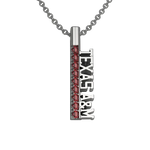 Load image into Gallery viewer, Sterling silver TEXAS A&M pendant with maroon garnets on a gray background.