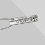 Load image into Gallery viewer, Oval silver TEXAS A&M bar pendant shown on a light gray background