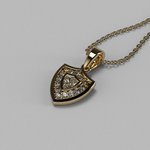 Load image into Gallery viewer, 14K yellow gold Aggie Shield™ pendant with lab grown shield-cut diamond and round melee diamonds.