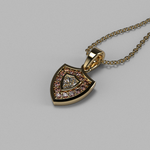 Load image into Gallery viewer, Angled view of the Aggie Shield™ diamond pendant in yellow gold with maroon garnet accents.
